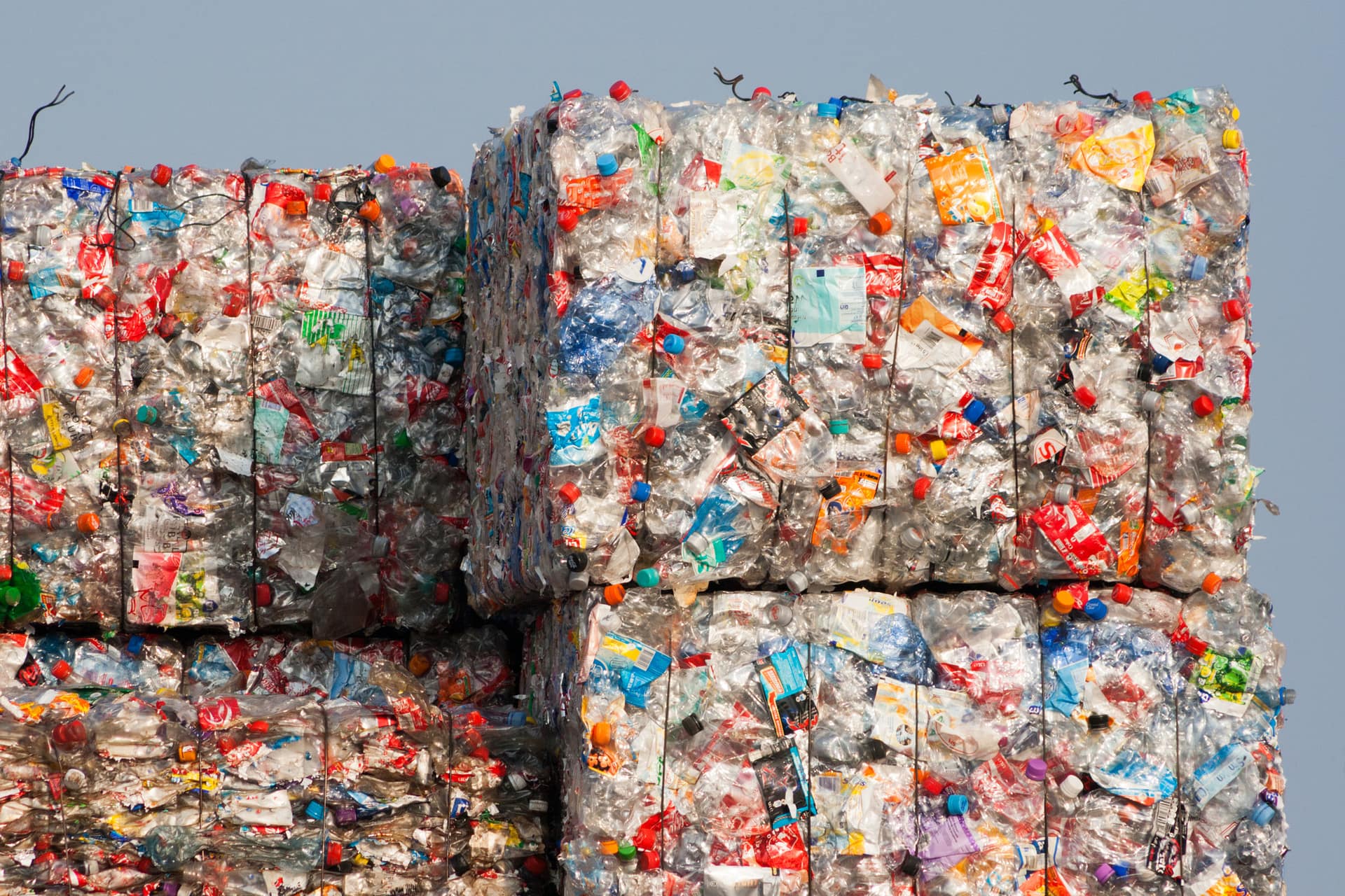 Compacted recyclable plastic waste at a recycling plant.